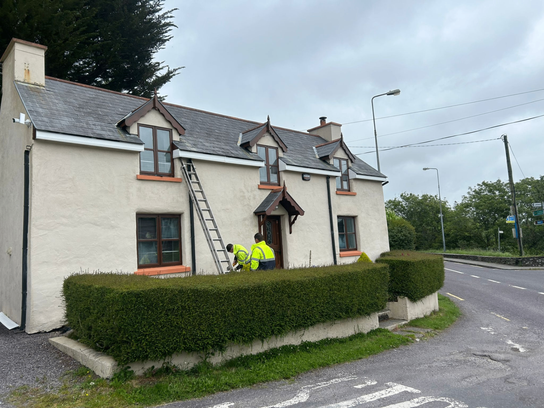 House exterior showing completed roofing and roofline work